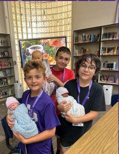 Family Consumer Science students practiced different skills required of caregivers of infants.  The students rotated through stations, read about skills, then had some hands on practice!